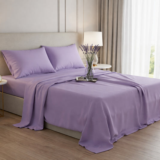 Rich lilac purple satin sheets featuring a purple flower arrangement accent