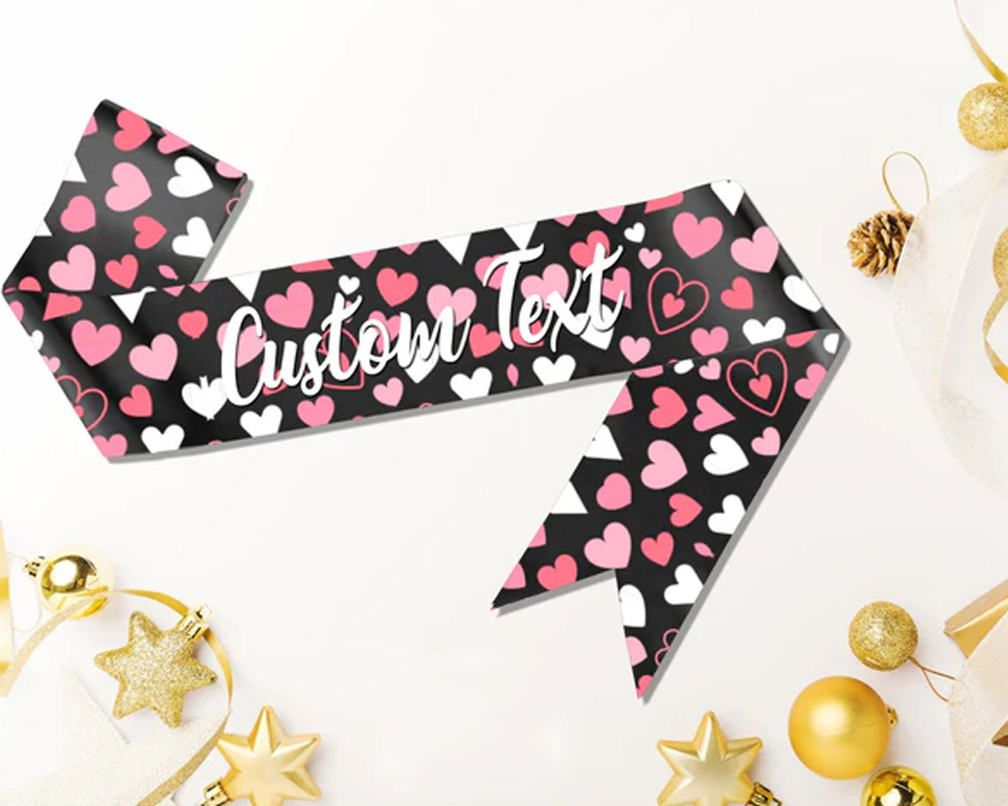 Black sash with pink and white hearts, featuring customizable text in elegant white script.