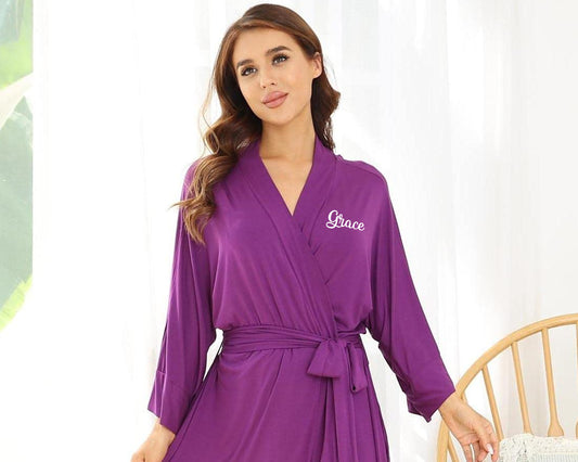 Woman wearing a purple robe with "Grace" written on the chest.