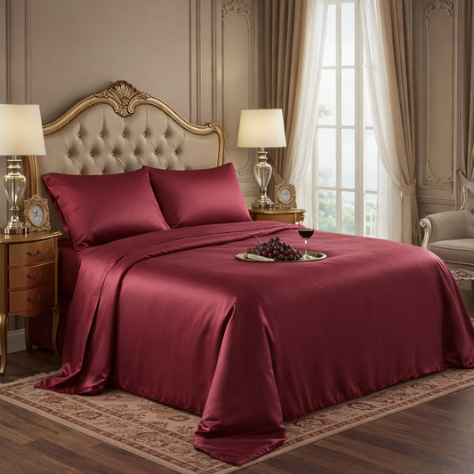 Elegant wine red satin sheets displayed on an ornate tufted headboard bed with a luxury finish