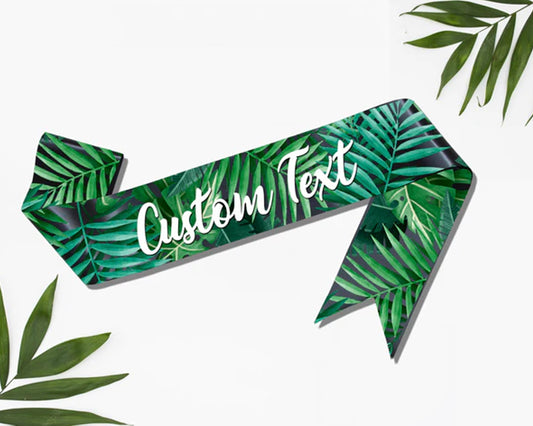 Green tropical leaf-themed sash with customizable text, ideal for parties, events, and special occasions.