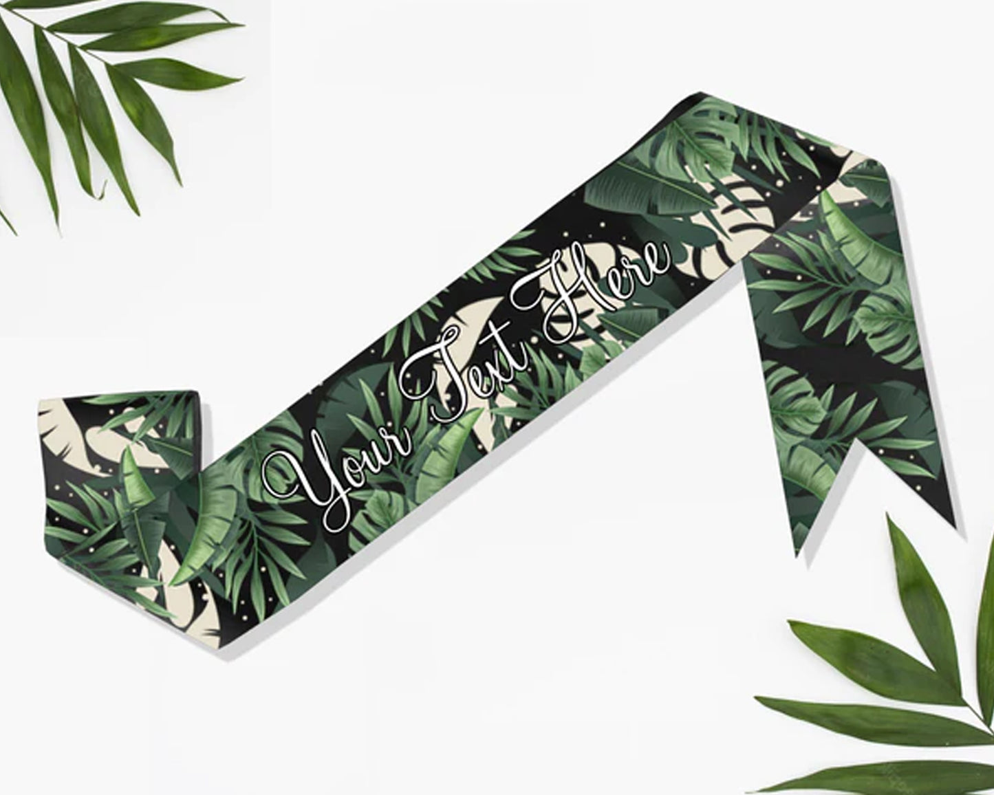 Satin sash with a vibrant tropical leaves print, perfect for themed events and celebrations.