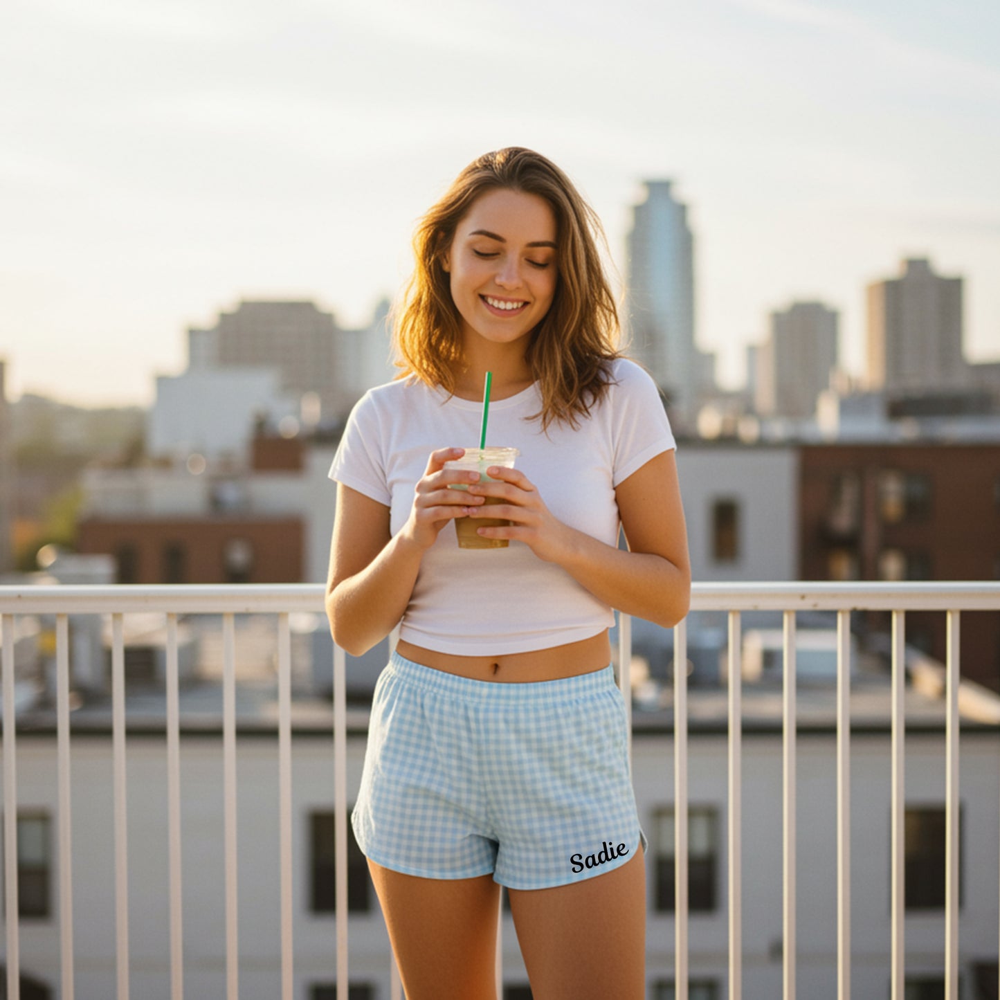 Back view of woman wearing blue and white checkered gingham pajama shorts