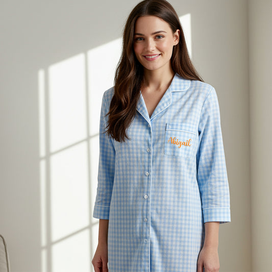 Personalized light blue gingham sleepshirt with orange Abigail embroidery on pocket