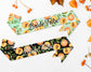 Two stylish sashes with peach-themed designs, one in mint green and the other in black, featuring "Bride Tribe" text for bachelorette celebrations.