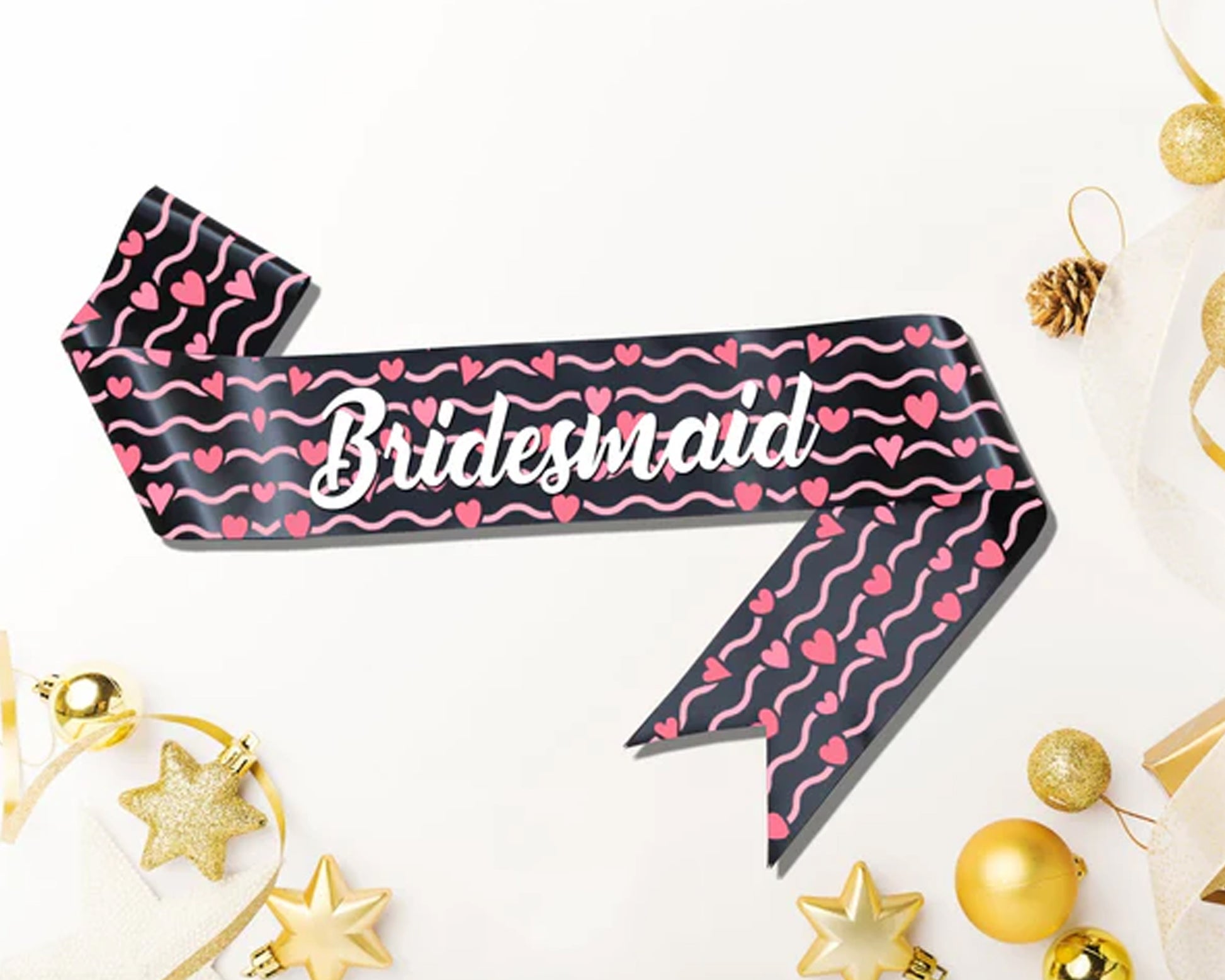 Black bridesmaid sash with pink heart and wave patterns, featuring "Bridesmaid" in elegant white script.