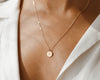 Custom round pendant necklace from USA Blissful World, featuring a personalized engraving.