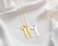  Gold and silver bar necklaces with personalized engravings and heart charms, beautifully displayed on soft white fabric.