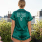 Back view of emerald green satin pajamas with silver Wake Up and Hit Zero cheer slogan