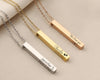 Personalized vertical bar necklaces with engraved names, messages, and paw print design