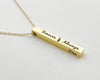  A gold necklace with a rectangular pendant engraved with a heartfelt message and a name.