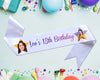 White ribbon with "Leo's 18th Birthday" in colorful script, decorated with two star-shaped cutouts containing photos of a young person.