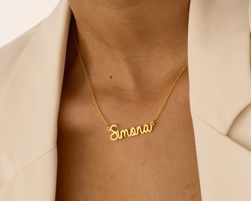 Elegant gold necklace featuring the name Simona in a delicate cursive design.