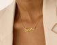 Elegant gold necklace featuring the name Simona in a delicate cursive design.