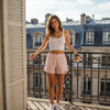 Woman wearing pink and white gingham shorts with name Abigail embroidery