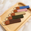 Set of colorful keychains on a wooden tray with a soft background