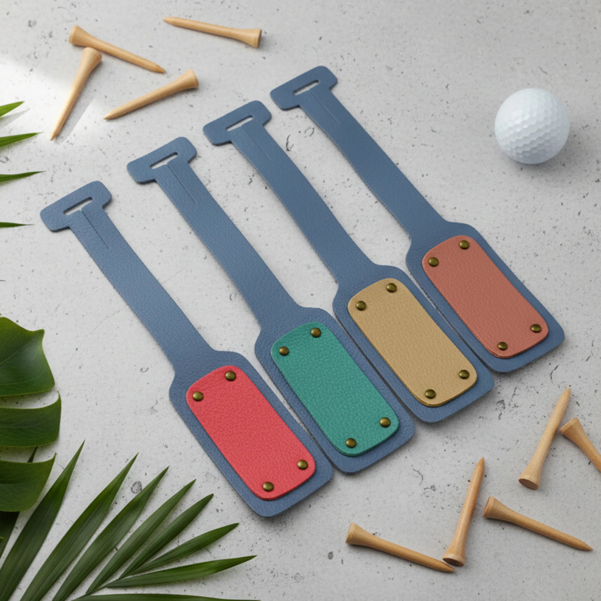 Set of colorful tags  on a light surface with golf balls and tees.