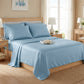 Serene sky blue satin bedding set in a bright bedroom with light wood furniture