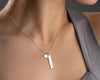 Silver bar necklace with heart charm, engraved with "Emily".
