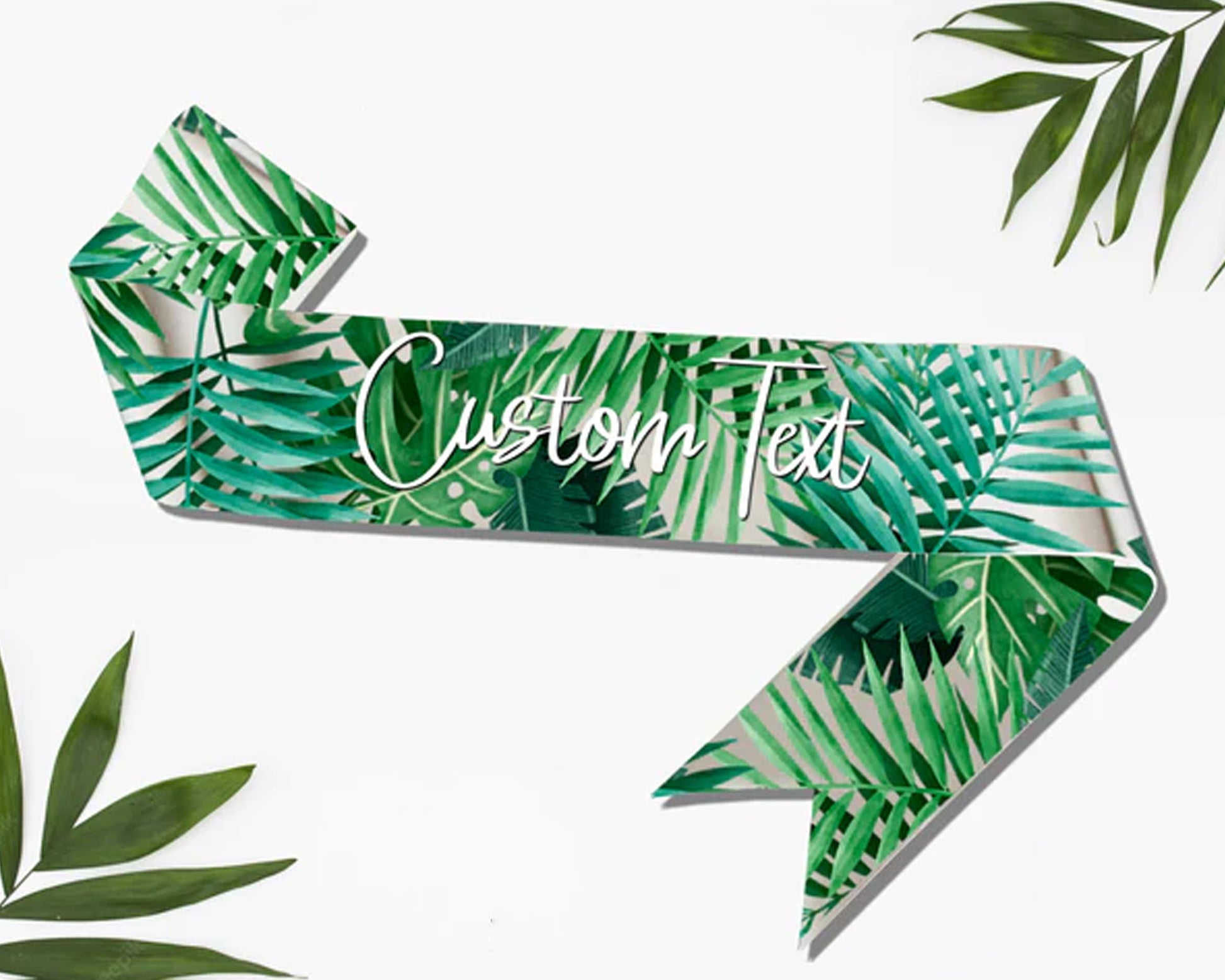 Elegant custom sash with a tropical leaves print, featuring personalized text for special occasions.