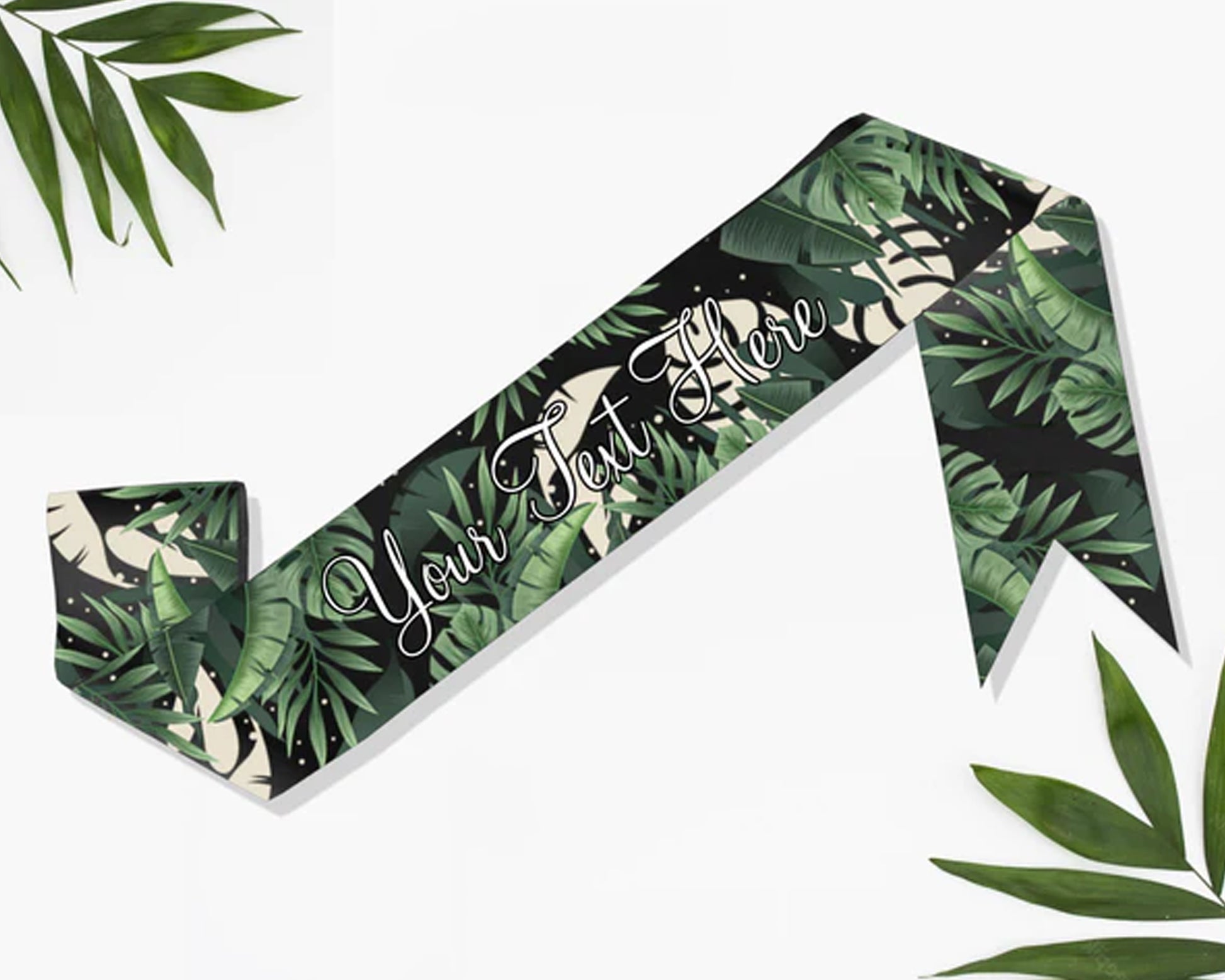 Satin sash with a vibrant tropical leaves print, perfect for themed events and celebrations.
