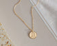 Elegant disc pendant with custom engraving for women.