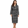Woman wearing a black and gray checkered robe on a white background