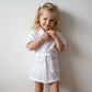 girl wearing a white waffle robe