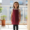 Young child wearing Red cotton apron