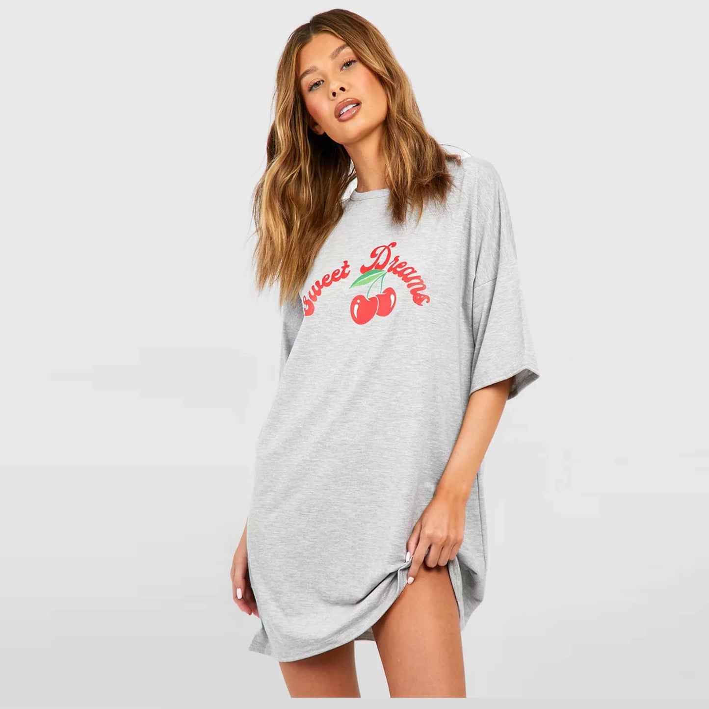  a gray oversized t-shirt with 'Sweet Dreams' and cherry design
