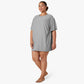 wearing a gray sleepshirt 
