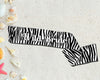 Trendy zebra print sash with custom text, perfect for a wild and fun celebration.