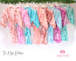 A collection of vibrant tie-dye robes in various colors, perfect for bridal parties, bridesmaids, and lounging in style.
